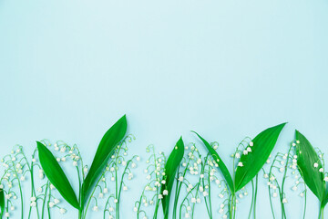 Lilies of the valley on a blue background.