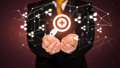 Hand holding social media icons