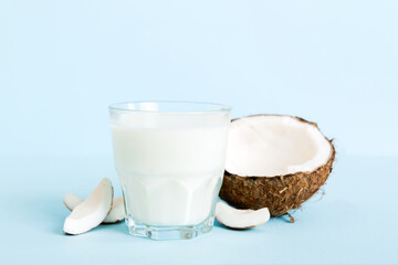 coconut products on white wooden table background. Dairy free milk substitute drink, Flat lay healthy eating