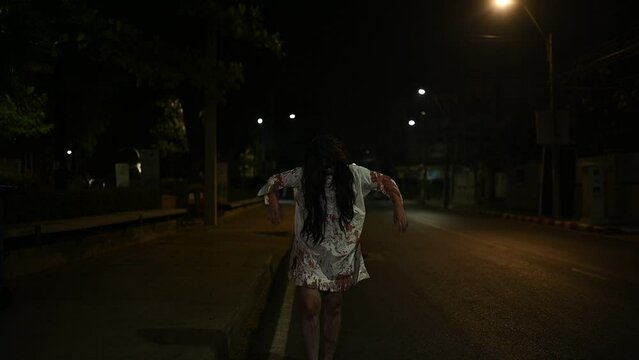 Horror woman concept,Ghost on the road in the city,A vengeful spirit on the street of the town,Halloween festival,Make up ghost face