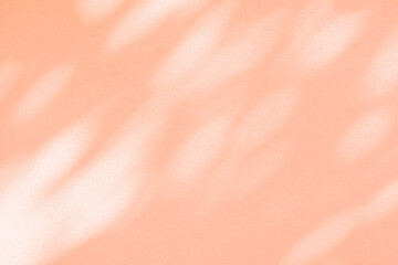 Light and shadow pink beige pastel abstract background. Natural leaves shadows and sunshine...