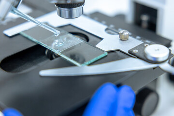 Microscope with chemical tube and glassware in laboratory, Science research technology.