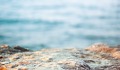 Rocky podium in front of the sea background for advertising