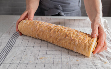Cake roll fresh and homemade bake on a towel with sugar