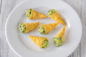Tortilla chips cones with guacamole