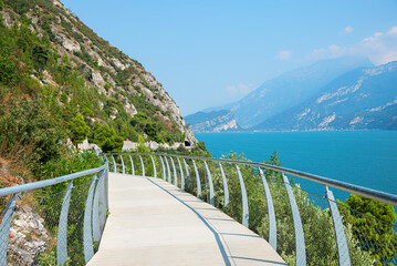adventurous cycling track Ciclopista del garda, along the lake Gardasee near Limone - obrazy, fototapety, plakaty