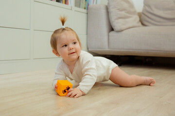 baby girl crawling on the floor at home