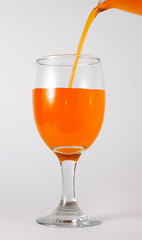 Orange juice in a wine glass.