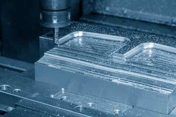 The CNC milling machine cutting stamping die part by solid end mill tool.