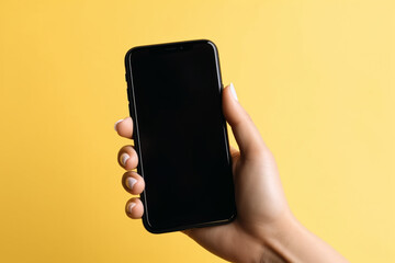Fototapeta na wymiar Female hand holding smartphone with blank screen isolated on yellow pastel background.Front view.Copy and text space.Created with generative ai