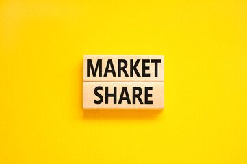 Market share symbol. Concept words Market share on beautiful wooden block. Beautiful yellow table yellow background. Business and Market share concept. Copy space.