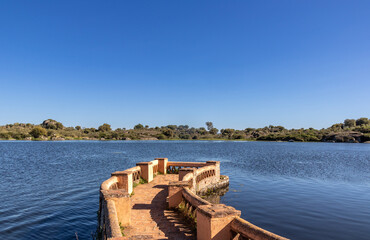 Pier in one of the lagoons of the Natural Reserve of Los Barruecos, Malpartida de Cáceres, Spain