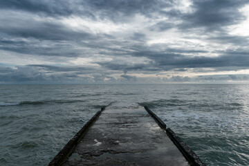 pier and clouds