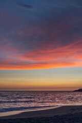 Fototapeta na wymiar Colorful sunset on the beach