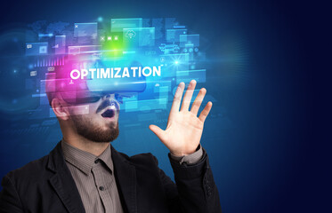 Businessman looking through Virtual Reality glasses