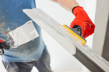 Preparing walls for painting - leveling with putty
