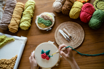 Hand crafts concept, Woman leisure embroidery at home..
