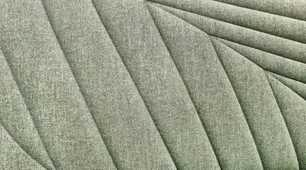close up view of green cotton woven sofa cushion fabric texture background. natural leaf pattern of...