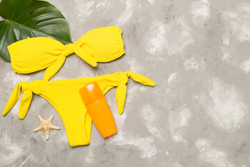 Beach accessories on concrete background, flat lay