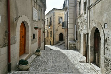 A narrow street among the old houses of Guardia Sanframondi, a small town of Benevento province, Italy.