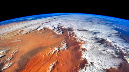 Clouds over the Sahara desert. Digital Enhancement. Elements by NASA