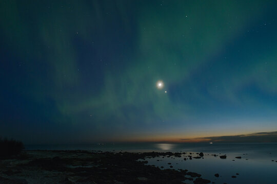 aurora borealis in the starry sky over the sea