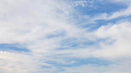 Naklejka premium blue sky with white clouds background