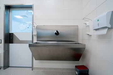 Disinfection procedure in the clinic sink in which doctors wash their hands before surgery