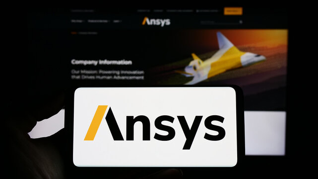 Stuttgart, Germany - 04-27-2023: Person holding cellphone with logo of US simulation software company Ansys Inc. on screen in front of business webpage. Focus on phone display.