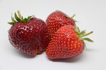 red three strawberry isolated white background