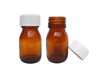 Two brown medicine glass bottle containers isolated on white background. Pill bottle mock up. Pharmaceutical packaging. Vitamins and supplements jar with white lid.