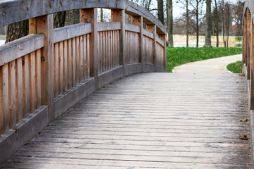 A wooden bridge with a sign that says'the word park'on it