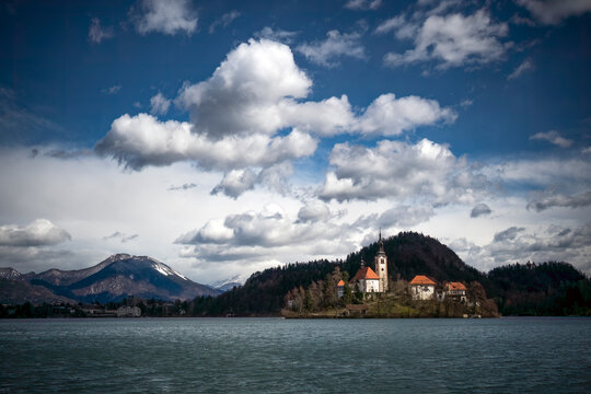 The island on Lake Bled under cloudy sky in Slovenia