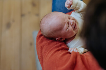 Close-up of father cudddling his little son.