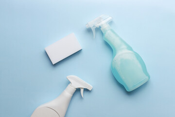 Flat lay cleaning sprays and sponge. Bring cleanliness. Cleaning products