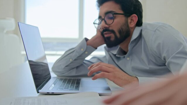 Multiracial business employees unmotivated staff sit at corporate office distracted from boring laptop job play mobile phone game tired bored lazy businessmen businesswoman feel low Generative AI