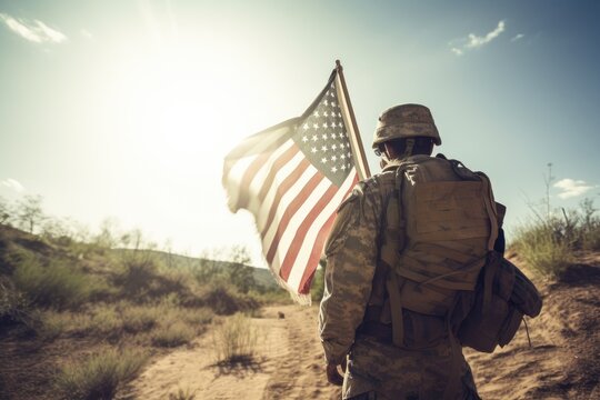 An American soldier with an American flag in his hand looks out into the clear weather for Day of Remembrance or July 4, Day of Remembrance. generative ai
