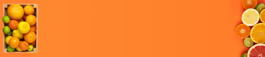 Fresh, fruity and juicy fruits concept as web banner. Flat layout banner with a box of whole fresh citrus fruits on the left and more cut fruits on the right side of the image on an orange background.