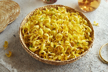 Golden dead-nettle flowers in a wicker basket