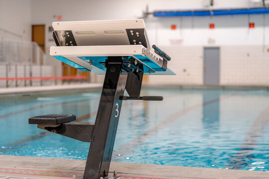 Starting block at a public interior swimming pool / natatorium sports facility. - Powered by Adobe