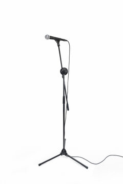 side view of a profosssionnal microphone and his stand isolated on white background