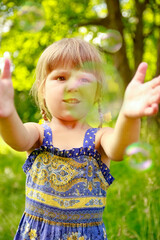 happy child having fun playing in the nature park