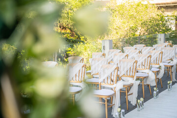 A beautiful wedding ceremony with flowers on the terrace at sunset