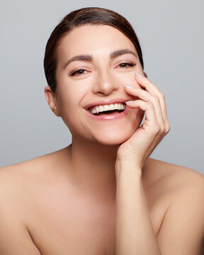 Beauty and Skincare Concept. Carefree smiling natural woman with nude makeup on a flawless skin