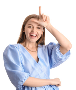 Young woman in dress showing loser gesture on white background