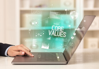 Side view of a business person working on laptop