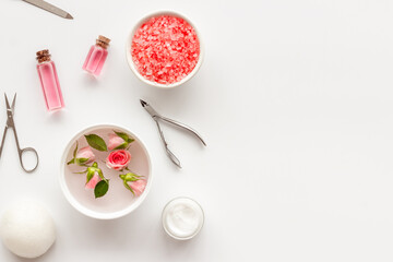Hands and nail care spa set with pink roses flowers. Beauty care salon spa.