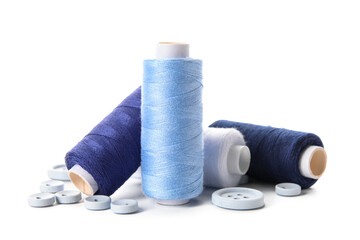Set of thread spools and buttons isolated on white background