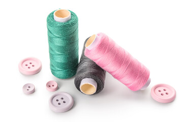 Thread spools and buttons isolated on white background