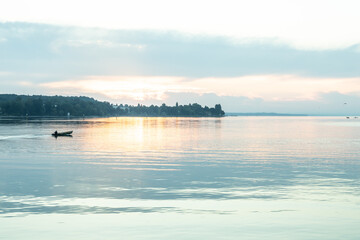 Beautiful sunrise view from Imperia statue at harbor entrance on lake Constance in early morning hours. Steamer harbor, Constance, Baden-Württemberg, Germany, Europe.